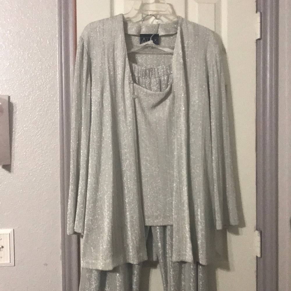 Silver glittery pants suit.